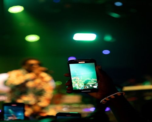 Central smartphone showing the CrownTurboWorks event and mobile game guide